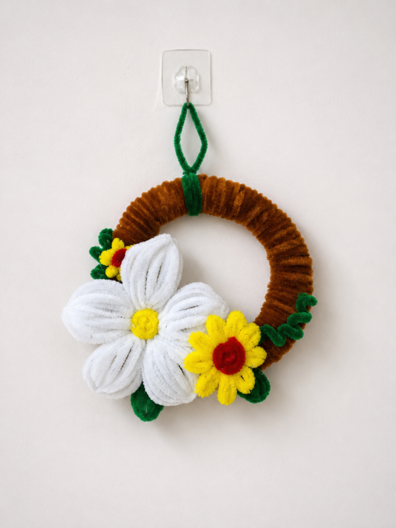 Add a touch of elegance to your home with this handmade floral wall hanging from SYDORA.